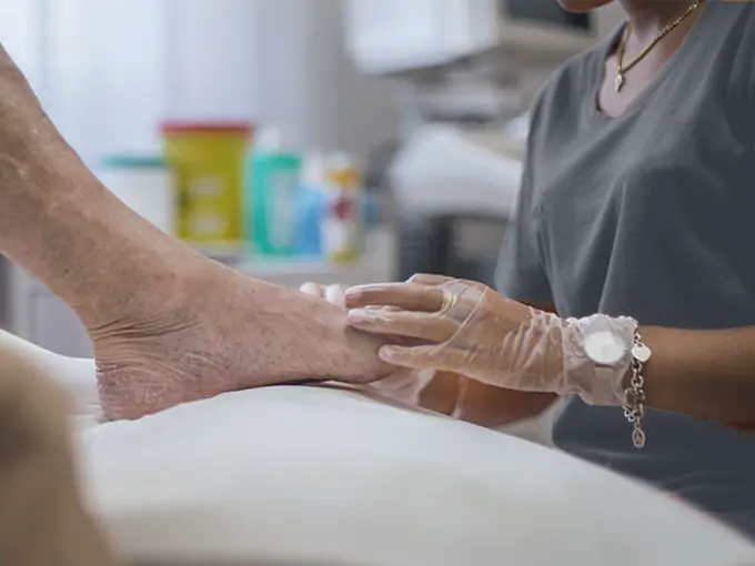Dr treating senior patient with diabetic foot conditions